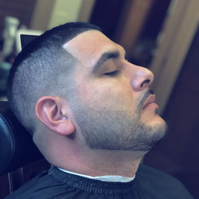 Clean beard detailing and tapered haircut by Hector Cardenas
